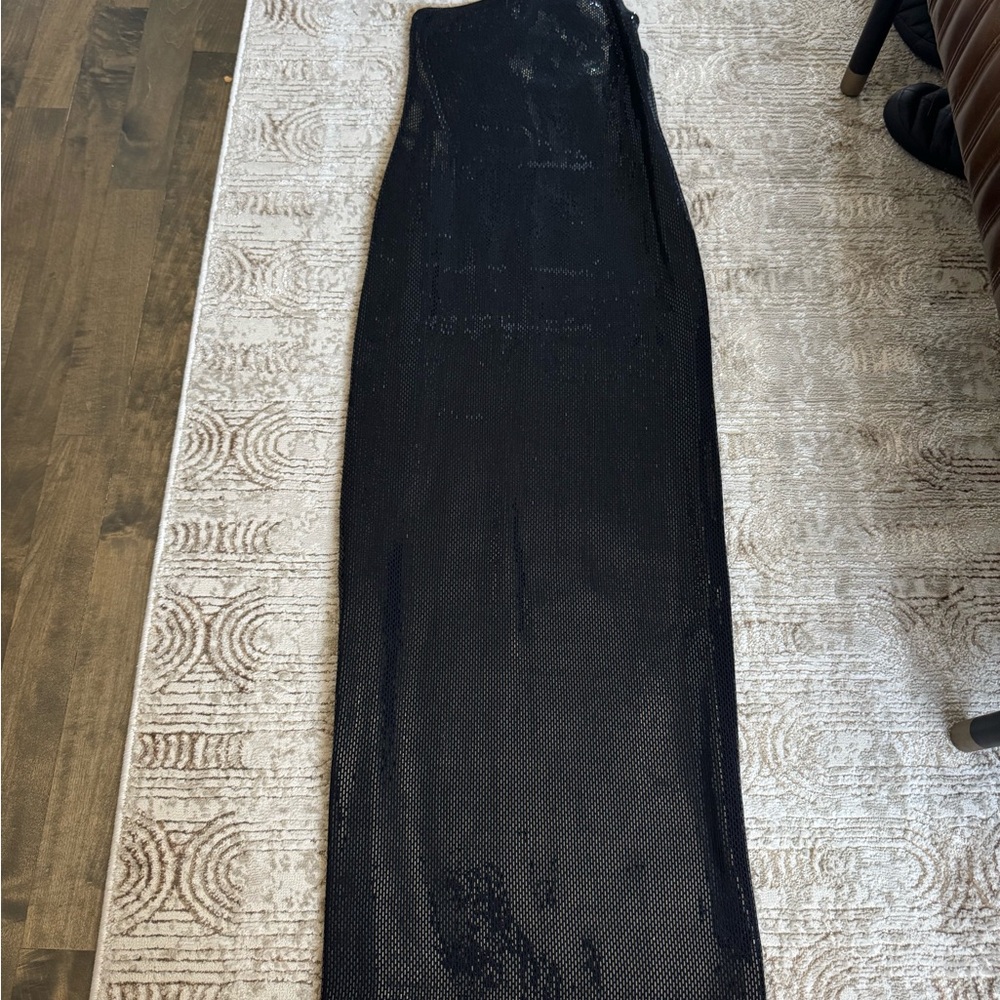 Description
St. John Evening Evening Gown
Black
Sleeveless with One-Shoulder - Picture 5 of 9